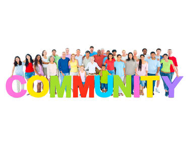group of people with colourful word community in front